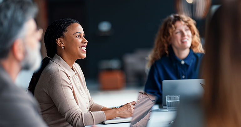 Three people in an office setup