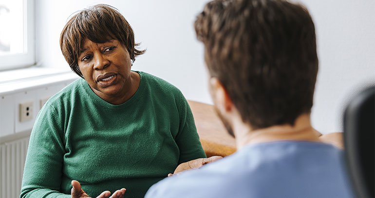 A patient and a doctor discussing the case
